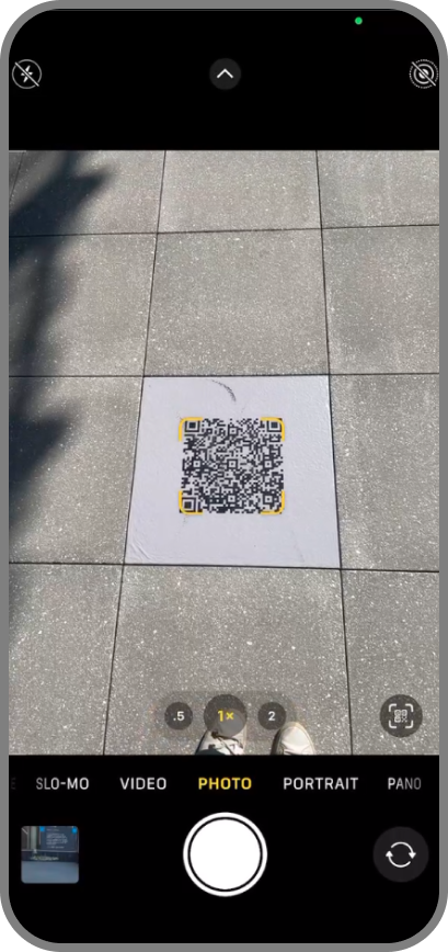 Native camera scanning a QR code printed on a campus sign