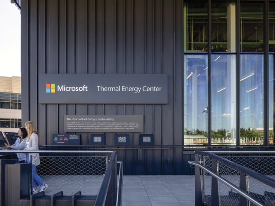Two people reading the interpretive signage panels at the Thermal Energy Center